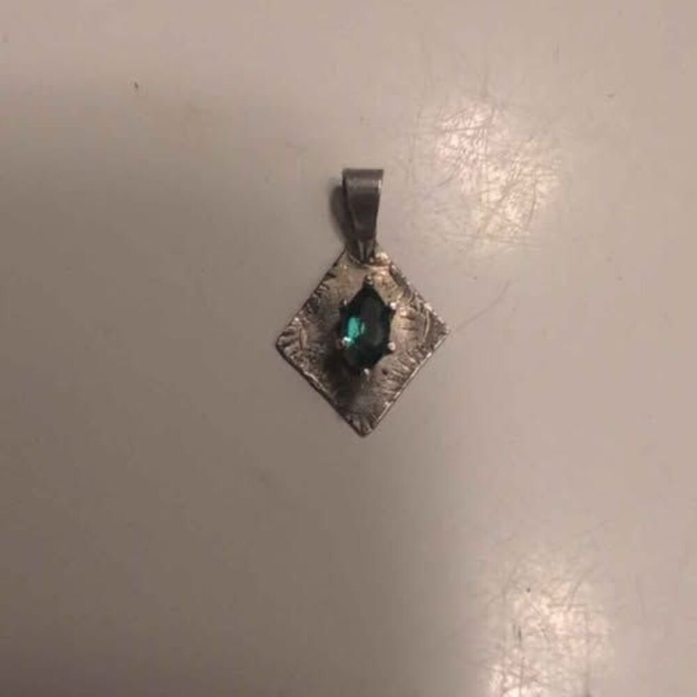 Silver tone green gemstone pendant